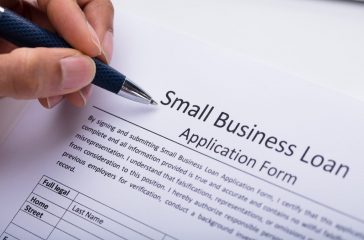 Businessperson Filling Small Business Loan Application Form