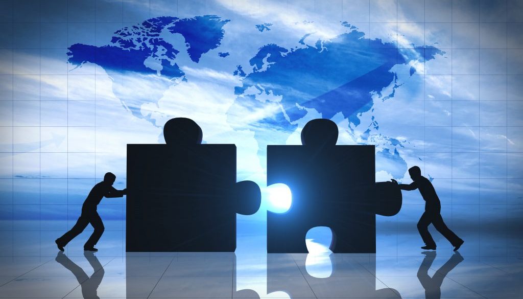 World Business teamwork puzzle pieces