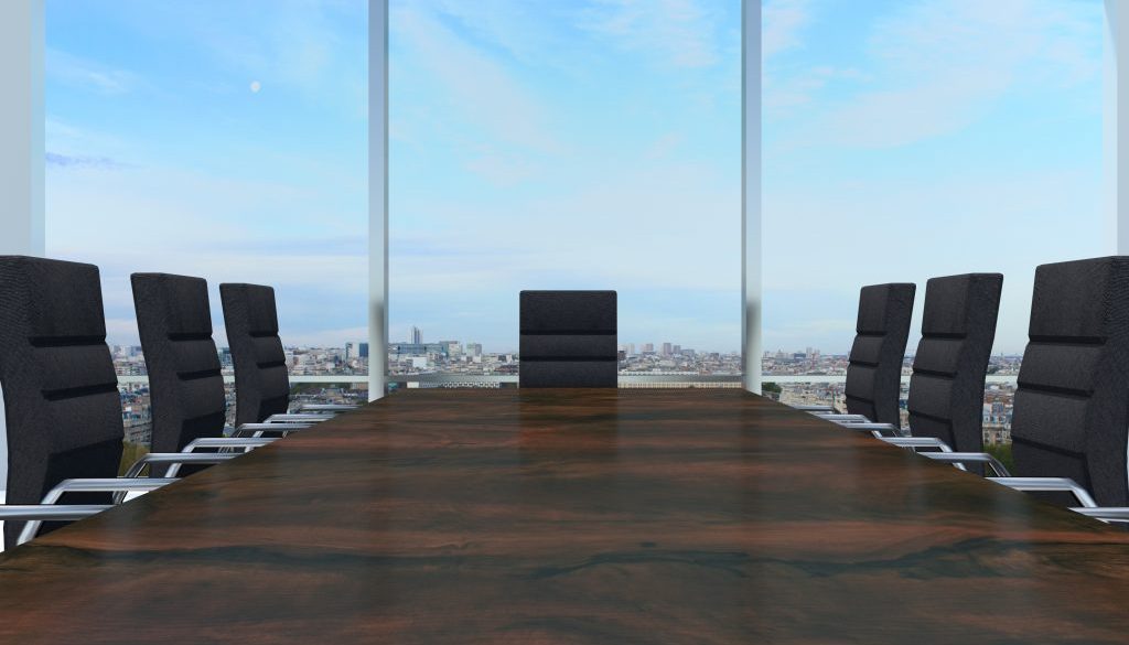 conference room with large wooden desk and skyline window