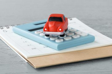 Toy car on caculator and calendar
