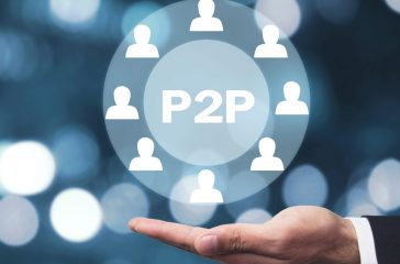 Hand holding P2P word with people icon. Concept of peer to peer P2P