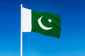 Waving flag of Pakistan on the blue sky background