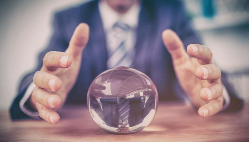 Businessman forecasting a crystal ball