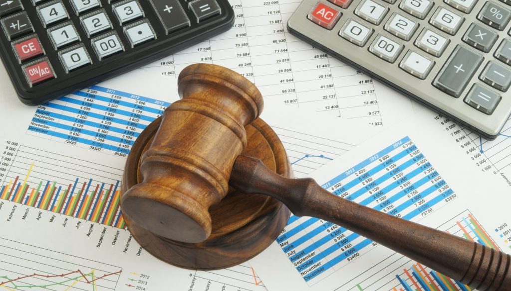Arbitration concept, judge gavel and calculators on financial documents