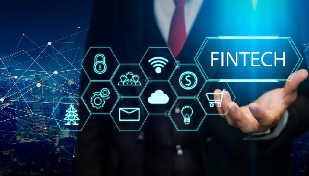 Fintech (financial technology) concept. Business person hold fintech illustration and icon technology.5G network wireless systems.IoT(Internet of Things), ICT,communication network concept.