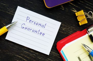 Business concept about Personal Guarantee with inscription on the piece of paper.