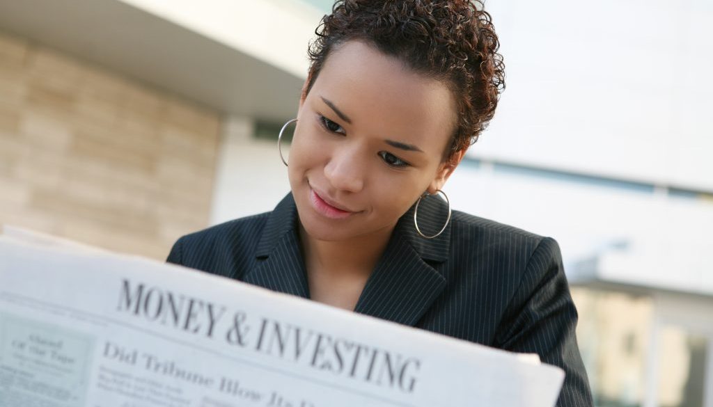 A african american business woman with newspaper