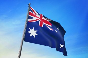 Australia flag waving on the blue sky 3D illustration