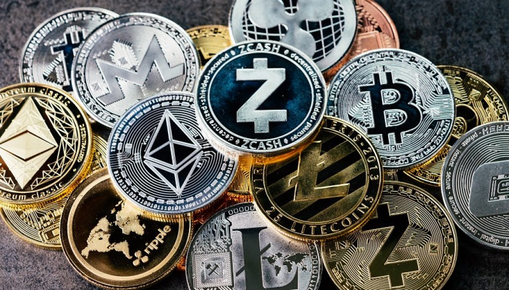 Crypto currency background with various of shiny silver and golden physical cryptocurrencies symbol coins, Bitcoin, Ethereum, Litecoin, zcash, ripple