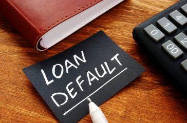 Business photo shows printed text Loan default