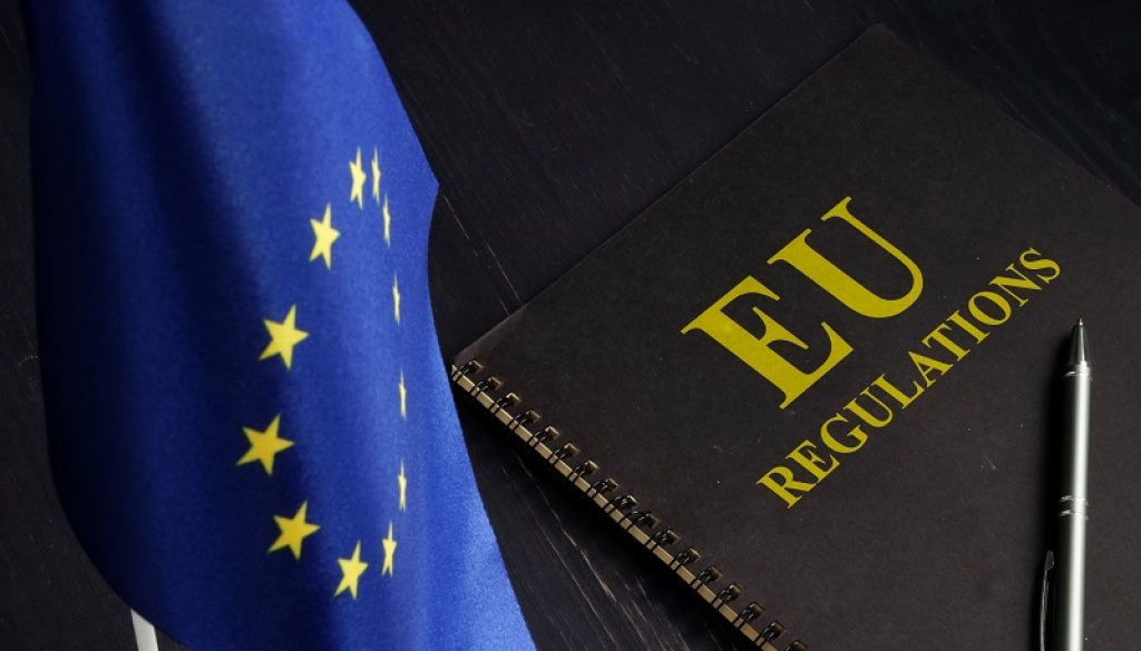 EU regulations and Europe Union flag.