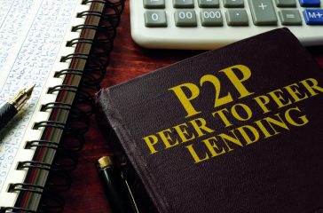 Book with title P2P peer to peer lending on a table.