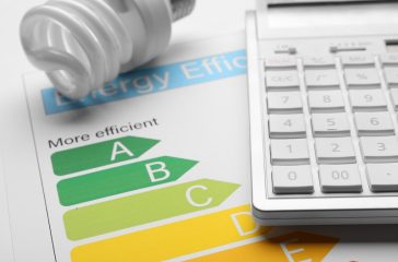 Energy efficiency rating chart, fluorescent light bulb and calcu