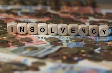 insolvency - cube with letters, money sector terms - sign with w